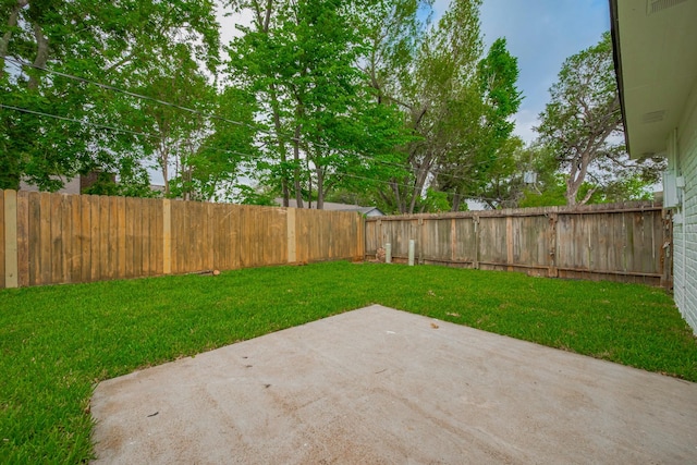 view of yard featuring a fenced backyard and a patio area