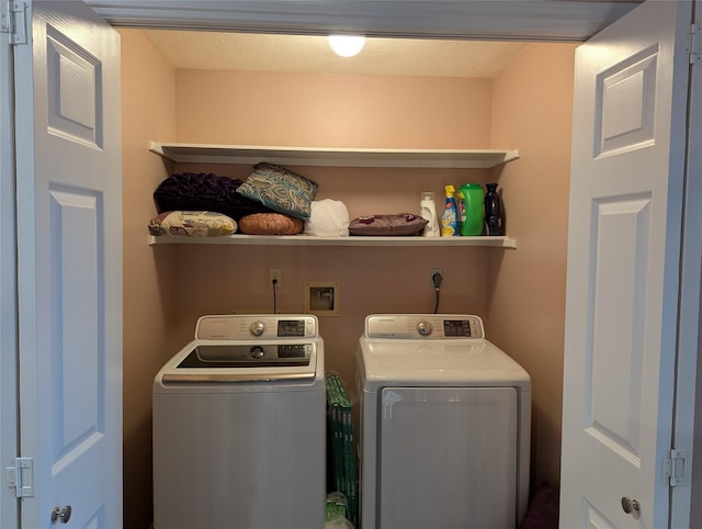 laundry room with separate washer and dryer