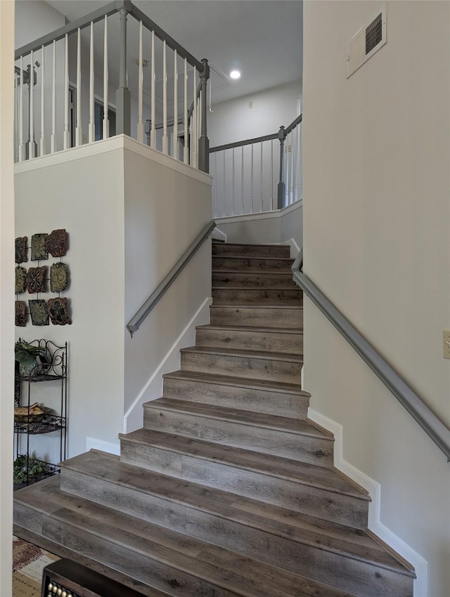 2 Skyland Pl, The Woodlands, TX 77381 - staircase with recessed lighting and wood finished floors