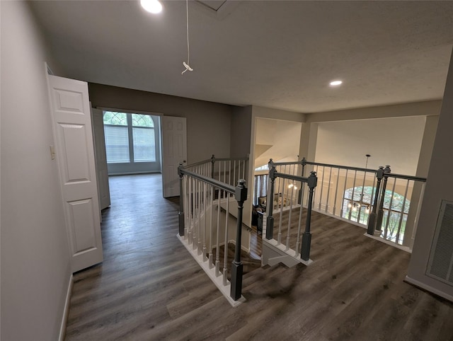 2 Skyland Pl, The Woodlands, TX 77381 - hall featuring wood finished floors, recessed lighting, attic access, and baseboards