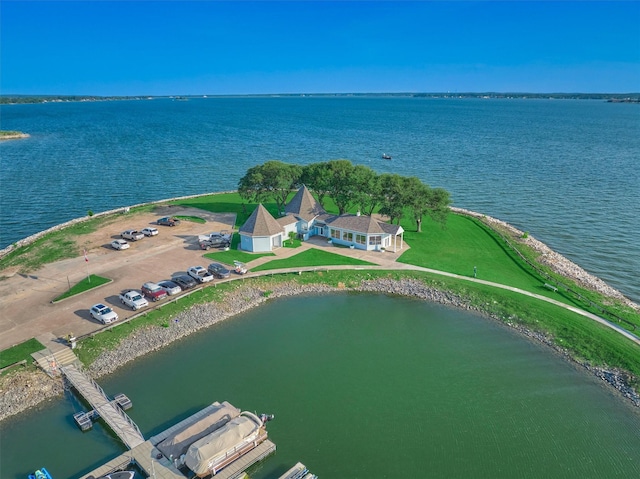 birds eye view of property featuring a water view