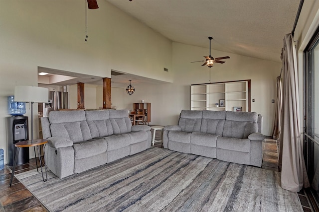 living room with a ceiling fan, high vaulted ceiling, and wood finished floors