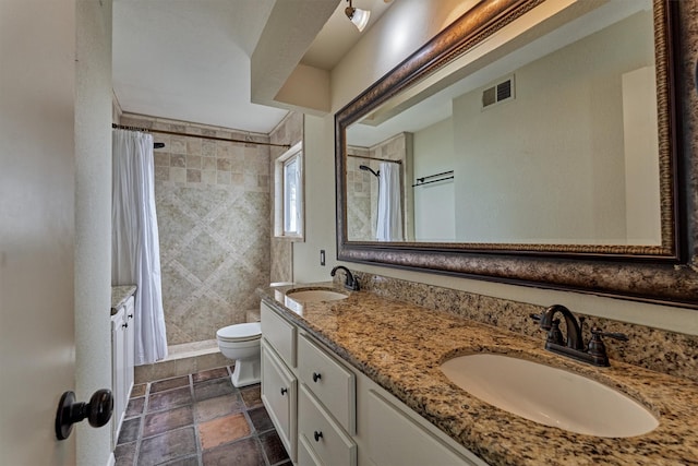 full bath featuring a sink, toilet, double vanity, and visible vents