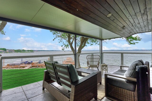 2012 Lakewood Ct, Willis, TX 77318 - view of patio featuring a water view, an outdoor living space, and a balcony