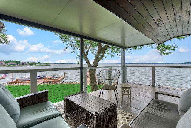 exterior space with a water view and plenty of natural light
