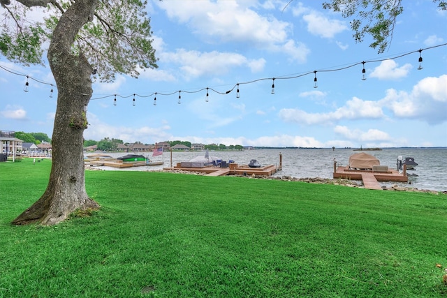 exterior space with a water view and a yard