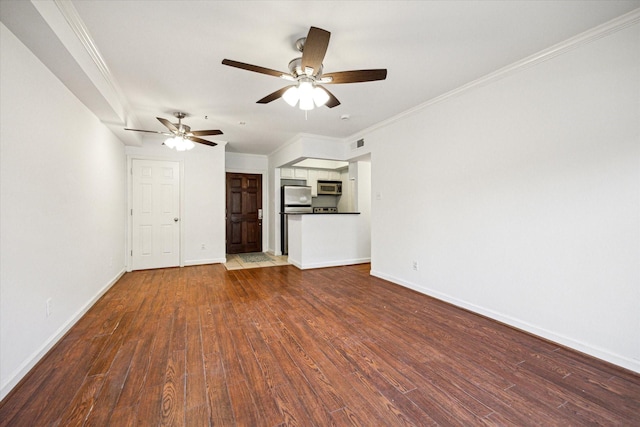 unfurnished living room with a ceiling fan, wood finished floors, and baseboards