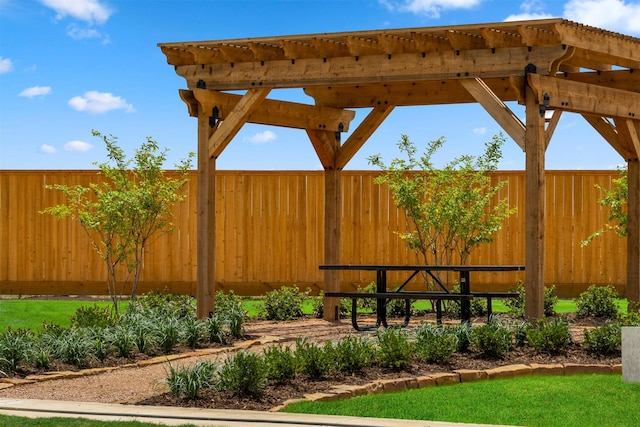 view of yard with a pergola and fence