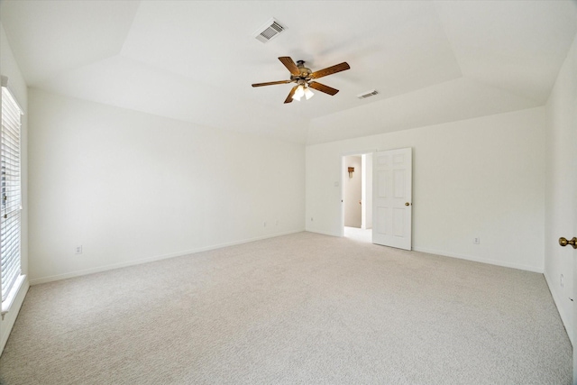 spare room with a wealth of natural light, ceiling fan, and visible vents