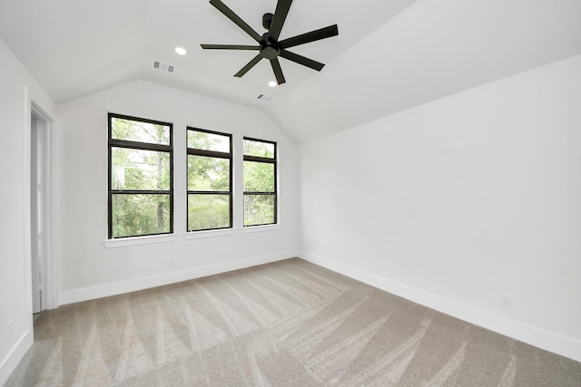 additional living space featuring visible vents, ceiling fan, lofted ceiling, and light carpet
