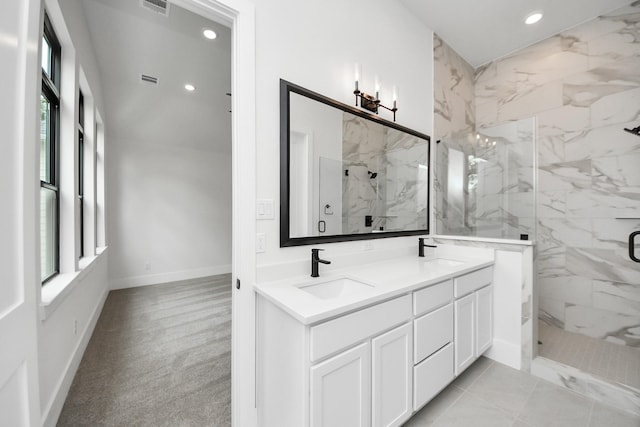 full bath with double vanity, recessed lighting, a marble finish shower, and a sink
