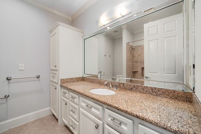 6115 Hamman St, Houston, TX 77007 - full bathroom featuring crown molding, vanity, tiled shower, tile patterned flooring, and baseboards