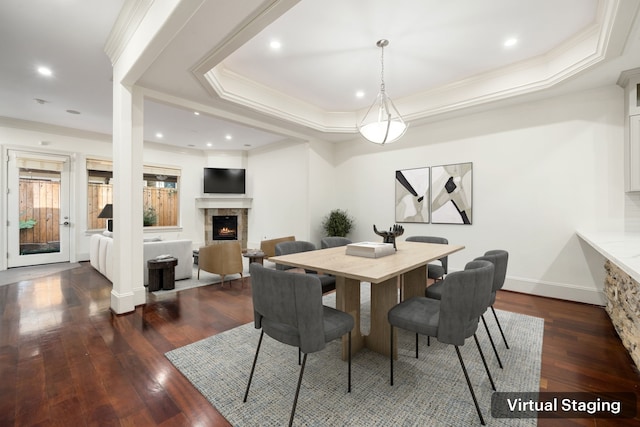 6115 Hamman St, Houston, TX 77007 - dining area featuring ornamental molding, dark wood-style flooring, a lit fireplace, a raised ceiling, and recessed lighting