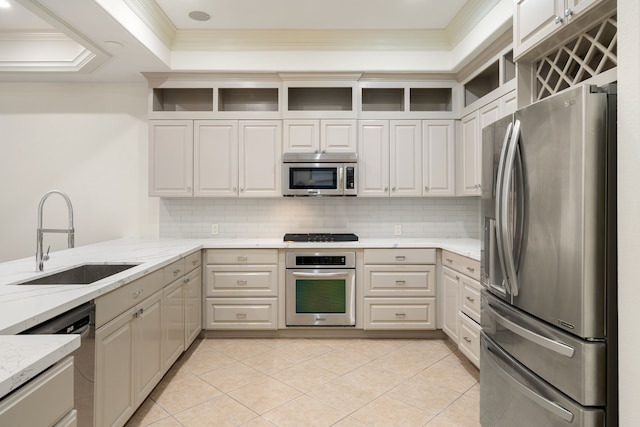 6115 Hamman St, Houston, TX 77007 - kitchen with appliances with stainless steel finishes, a sink, open shelves, light stone counters, and crown molding