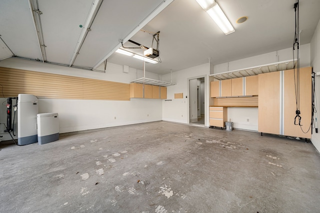 6115 Hamman St, Houston, TX 77007 - garage with a garage door opener and baseboards