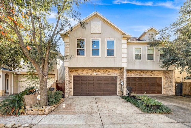 6115 Hamman St, Houston, TX 77007 - view of property featuring stucco siding, stone siding, concrete driveway, and a garage