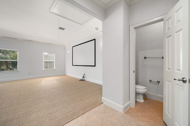 6115 Hamman St, Houston, TX 77007 - home theater room with crown molding, light colored carpet, baseboards, and light tile patterned floors