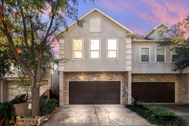 6115 Hamman St, Houston, TX 77007 - multi unit property with concrete driveway, an attached garage, stucco siding, and stone siding