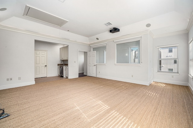 6115 Hamman St, Houston, TX 77007 - unfurnished living room featuring attic access, light colored carpet, ornamental molding, baseboards, and a sink