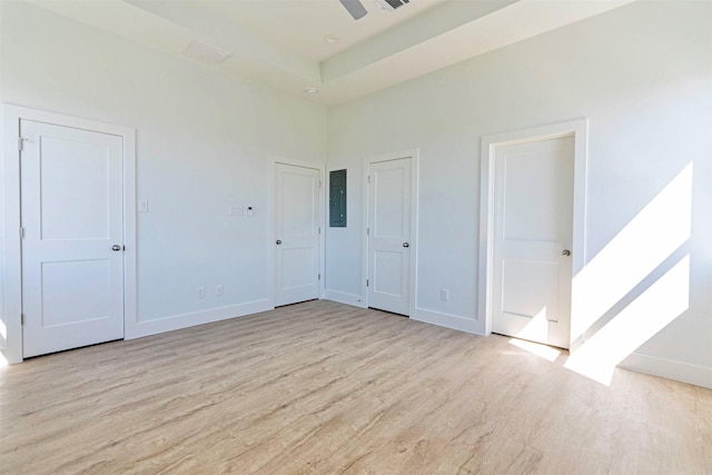 4206 Mason Dr, Galveston, TX 77554 - unfurnished bedroom with baseboards, electric panel, and wood finished floors