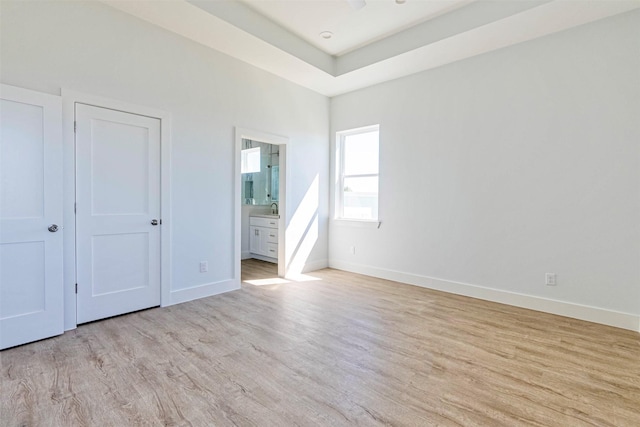 4206 Mason Dr, Galveston, TX 77554 - unfurnished bedroom featuring baseboards, connected bathroom, and wood finished floors