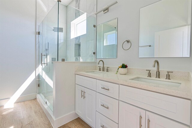 4206 Mason Dr, Galveston, TX 77554 - bathroom with double vanity, a sink, baseboards, and a shower stall