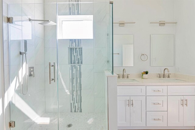 4206 Mason Dr, Galveston, TX 77554 - bathroom featuring double vanity, a sink, and a stall shower