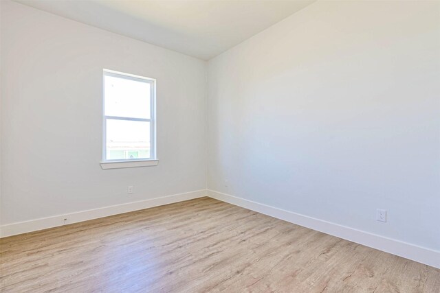 4206 Mason Dr, Galveston, TX 77554 - empty room featuring baseboards and wood finished floors
