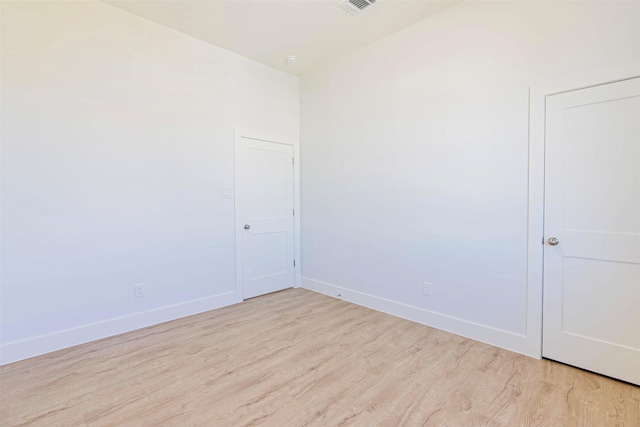 4206 Mason Dr, Galveston, TX 77554 - unfurnished room with baseboards and light wood finished floors