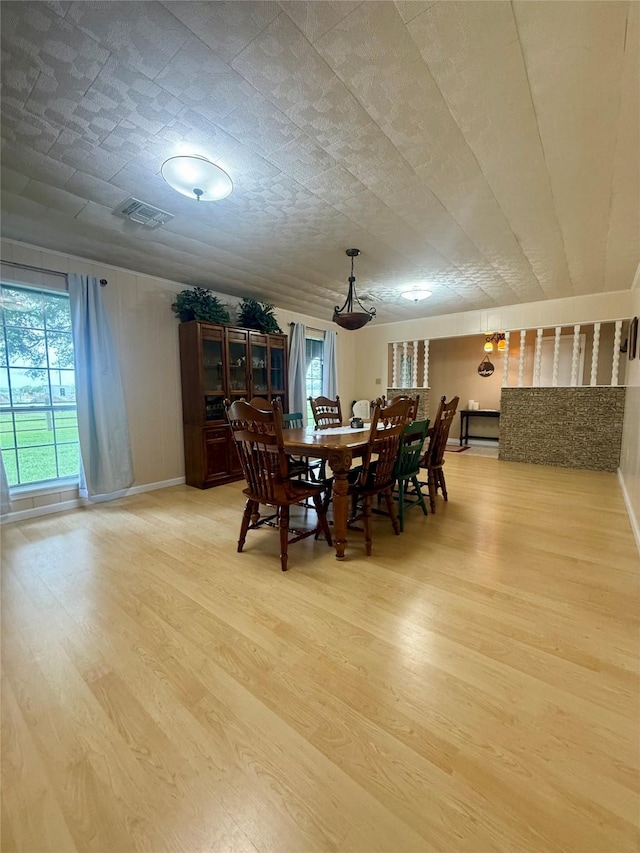 dining room featuring visible vents and light wood-style flooring