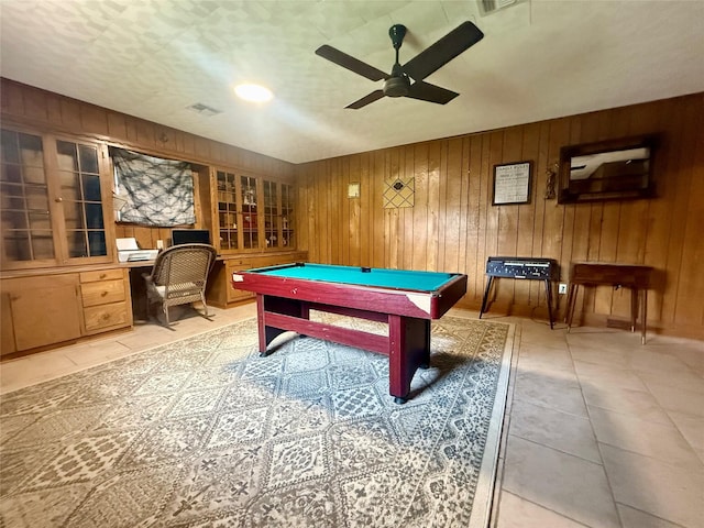 recreation room with a ceiling fan, billiards, light tile patterned floors, and wooden walls