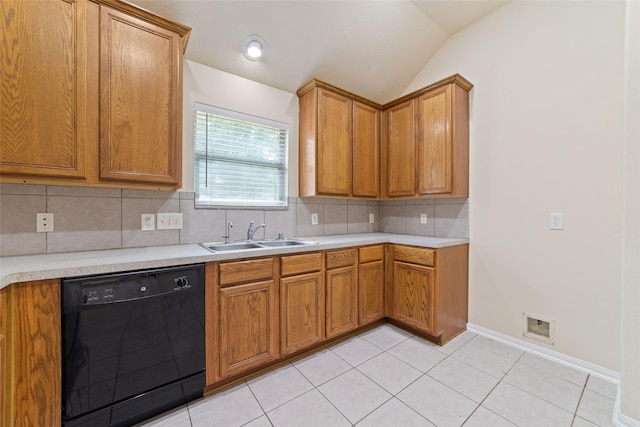 kitchen with a sink, dishwasher, light countertops, lofted ceiling, and tasteful backsplash