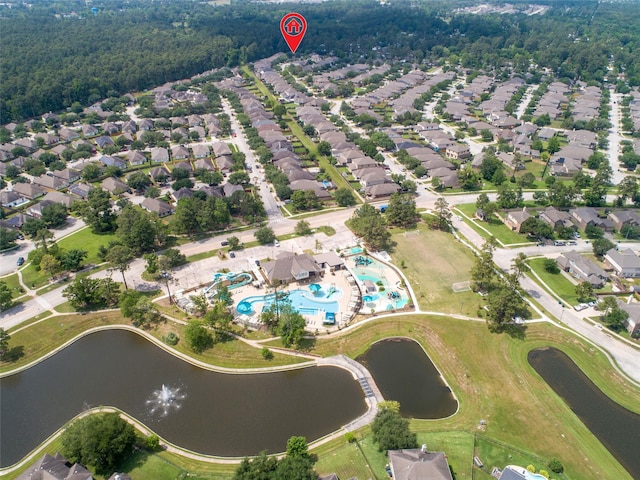 drone / aerial view with a residential view and a water view