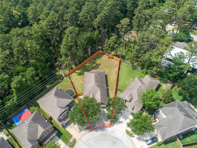 bird's eye view featuring a residential view and a forest view