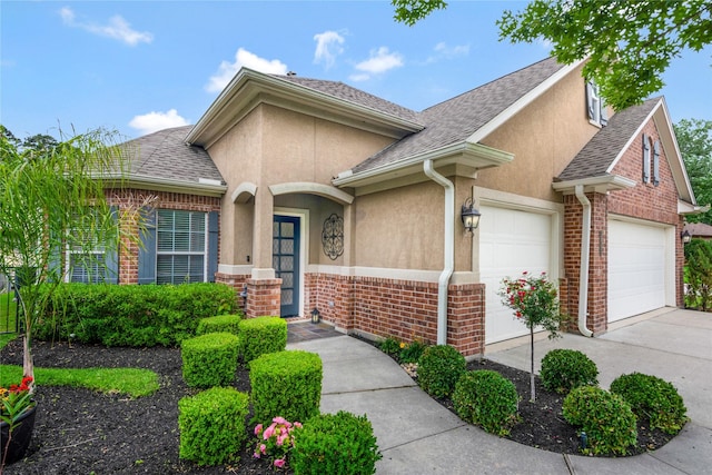 11068 First Lgt, Montgomery, TX 77356 - view of front of home with a shingled roof, stucco siding, and concrete driveway