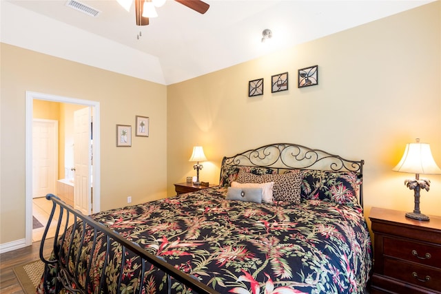 11068 First Lgt, Montgomery, TX 77356 - bedroom with connected bathroom, baseboards, wood finished floors, lofted ceiling, and visible vents