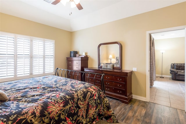 11068 First Lgt, Montgomery, TX 77356 - bedroom with baseboards, a ceiling fan, and wood finished floors