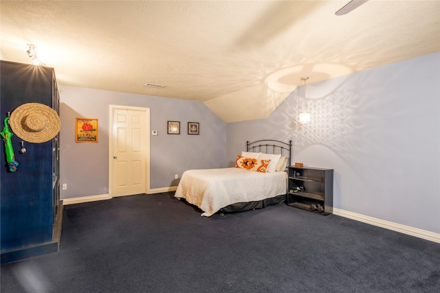 11068 First Lgt, Montgomery, TX 77356 - carpeted bedroom featuring baseboards and vaulted ceiling