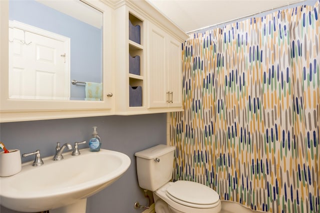 11068 First Lgt, Montgomery, TX 77356 - bathroom with a shower with shower curtain, toilet, and a sink