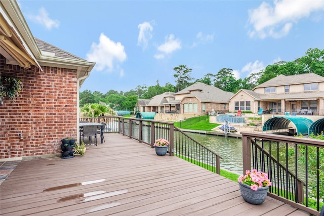 11068 First Lgt, Montgomery, TX 77356 - wooden deck with outdoor dining area and a water view
