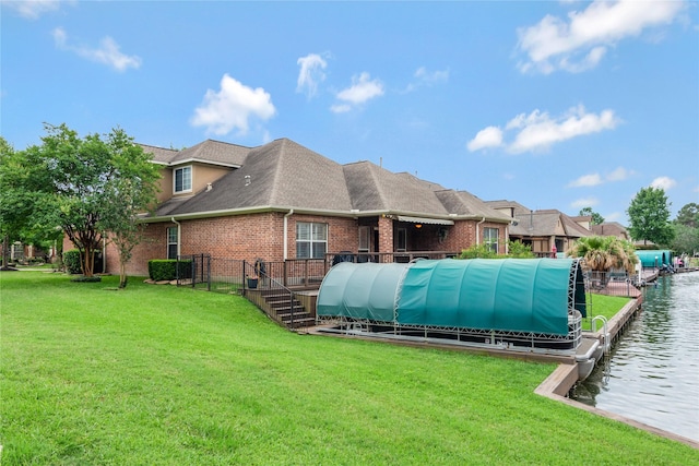 11068 First Lgt, Montgomery, TX 77356 - rear view of property with roof with shingles, fence, brick siding, a water view, and a yard