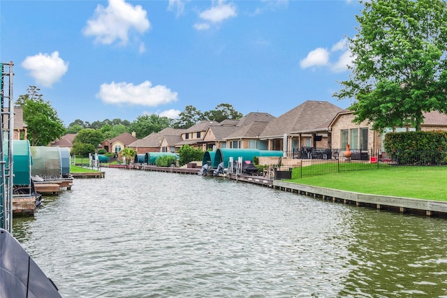 11068 First Lgt, Montgomery, TX 77356 - water view with a boat dock, a fenced backyard, and a residential view