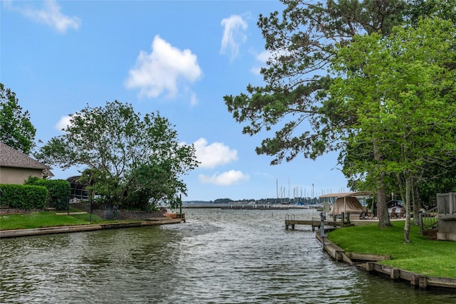 11068 First Lgt, Montgomery, TX 77356 - view of dock featuring a lawn and a water view