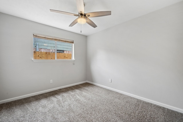 unfurnished room featuring baseboards, carpet, and ceiling fan