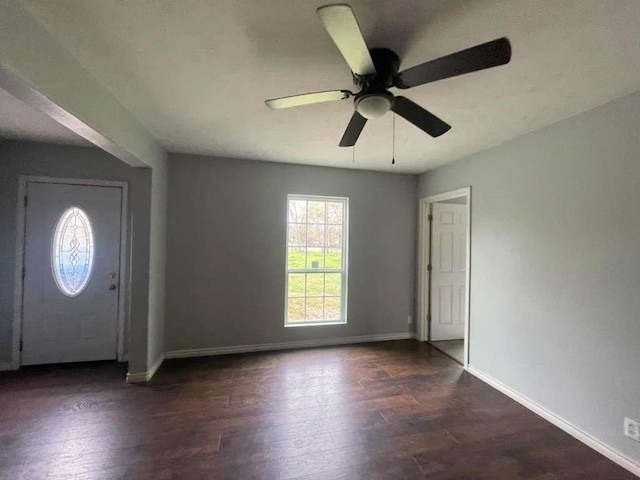 entrance foyer featuring baseboards, ceiling fan, and wood finished floors