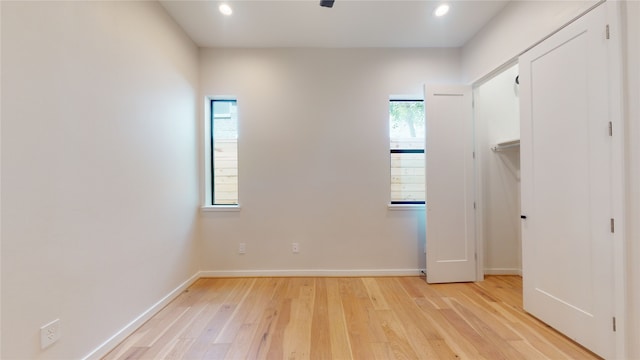 519 Memorial Heights Dr, Houston, TX 77007 - unfurnished bedroom with baseboards, recessed lighting, and light wood-style flooring