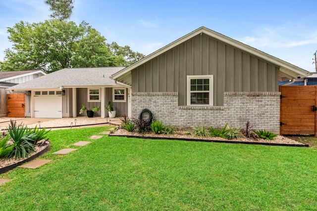 single story home featuring fence, brick siding, a garage, board and batten siding, and a front yard