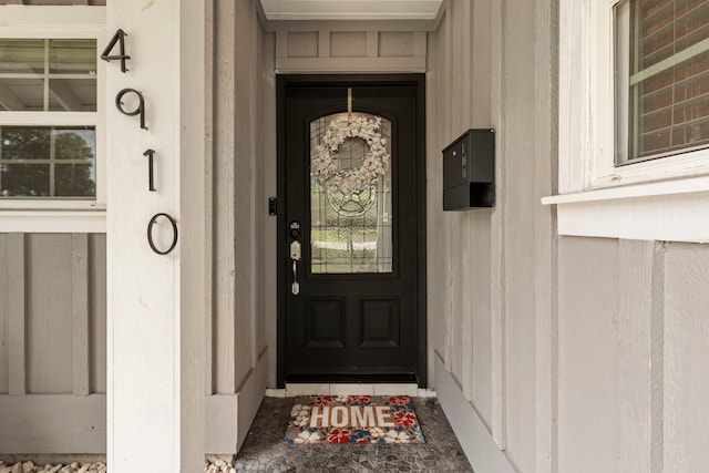 entrance to property featuring board and batten siding
