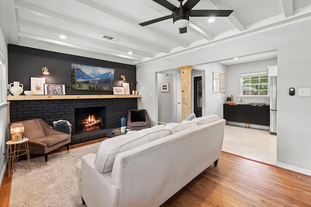 living room featuring visible vents, beam ceiling, a fireplace, ceiling fan, and recessed lighting