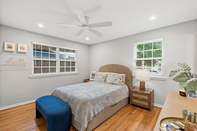 bedroom featuring baseboards, recessed lighting, and wood finished floors